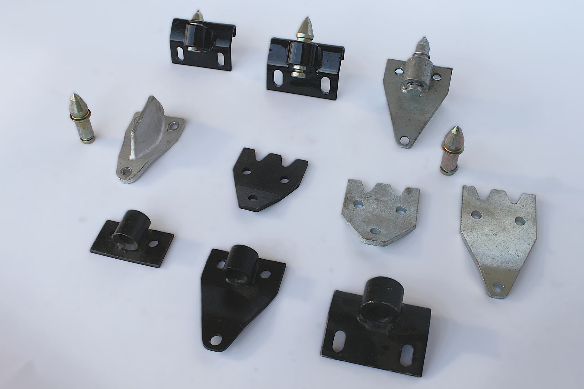 A bunch of metal pieces on a white surface