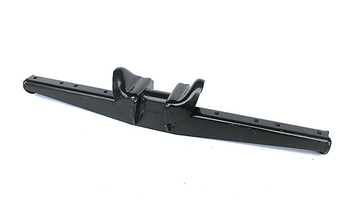 A black pen is sitting on a white surface.