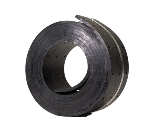 A black rubber ring with holes in it is sitting on a white surface
