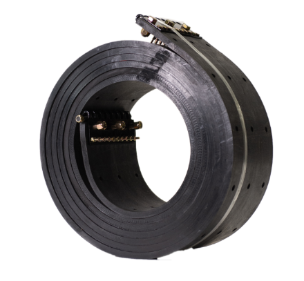 A black rubber coil with holes in it on a white surface