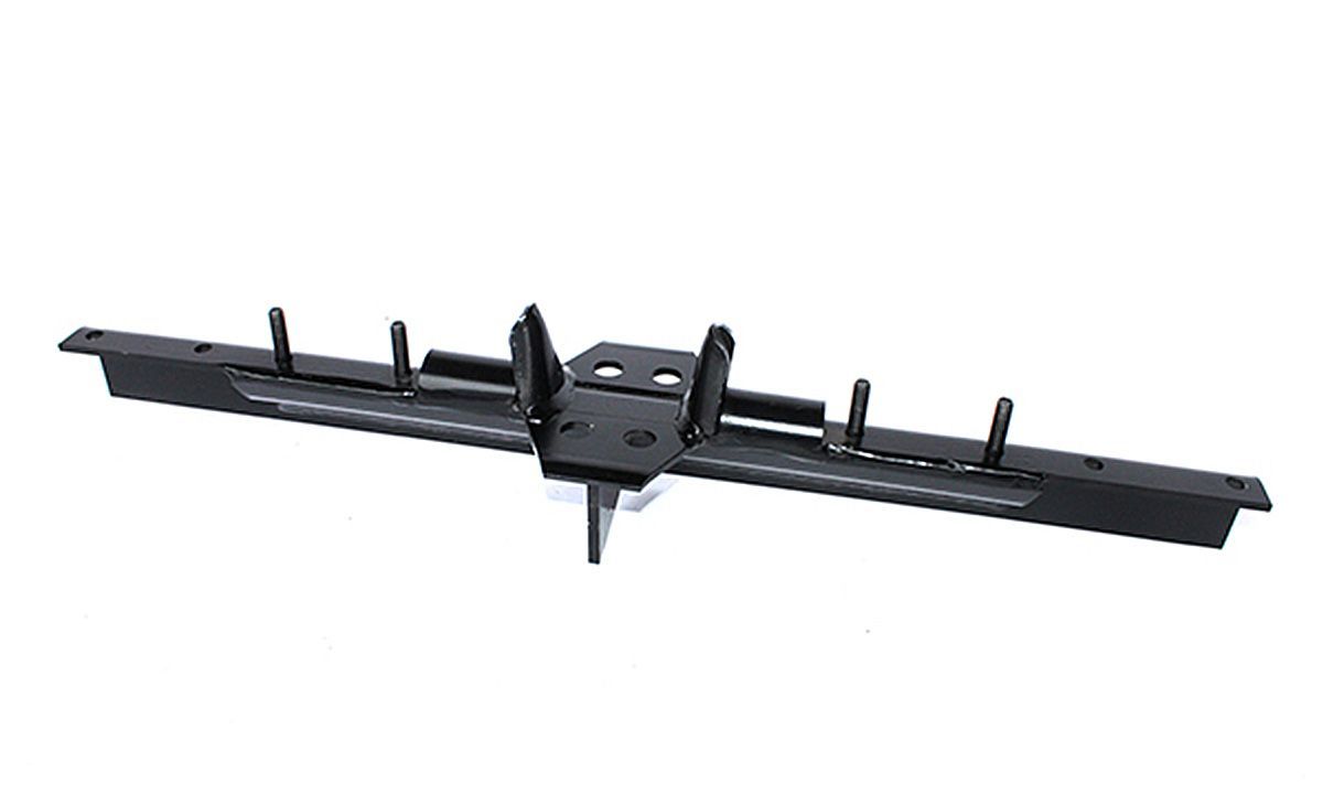 A black pen is sitting on a white surface.