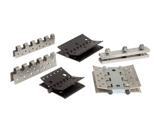 A group of metal pieces sitting on top of each other on a white surface.