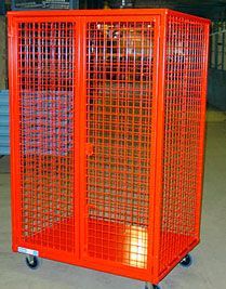 A red wire cage with wheels is sitting on the floor in a room.