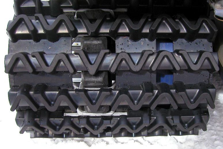 A close up of a row of tracks with the letters a and v on them