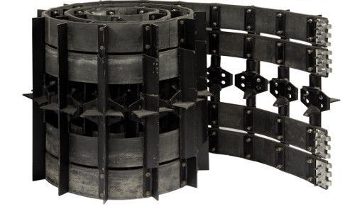 A close up of a roll of rubber tracks on a white background.