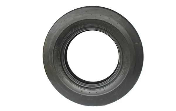 A black tire with a hole in the middle on a white background.