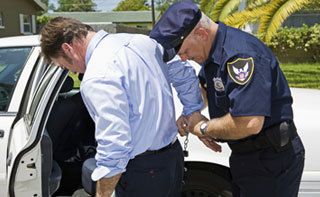 man being handcuffed by police