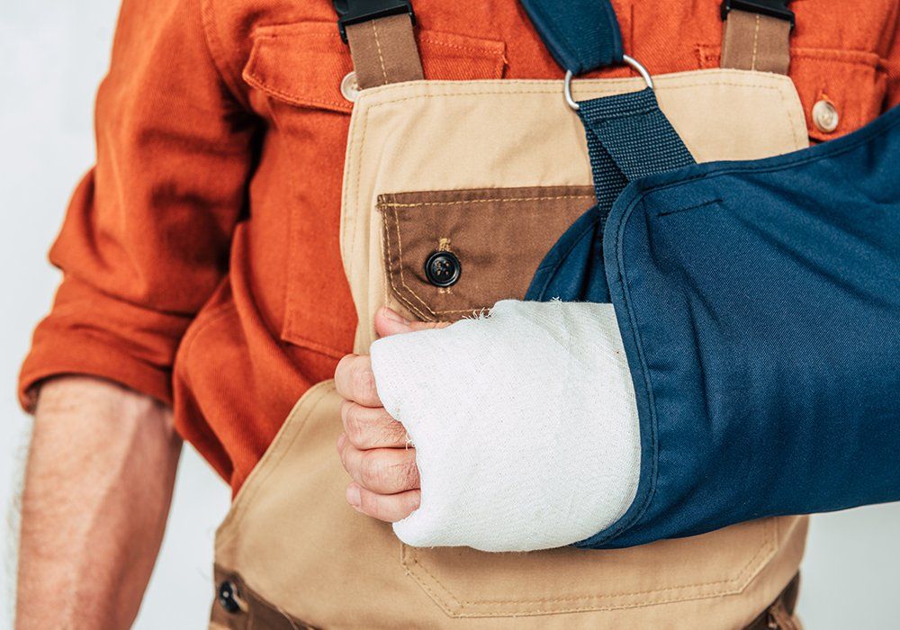 Man with Broken Arm and Bandage — Tukwila, WA — Law Offices of Daniel R. Whitmore, P.S.