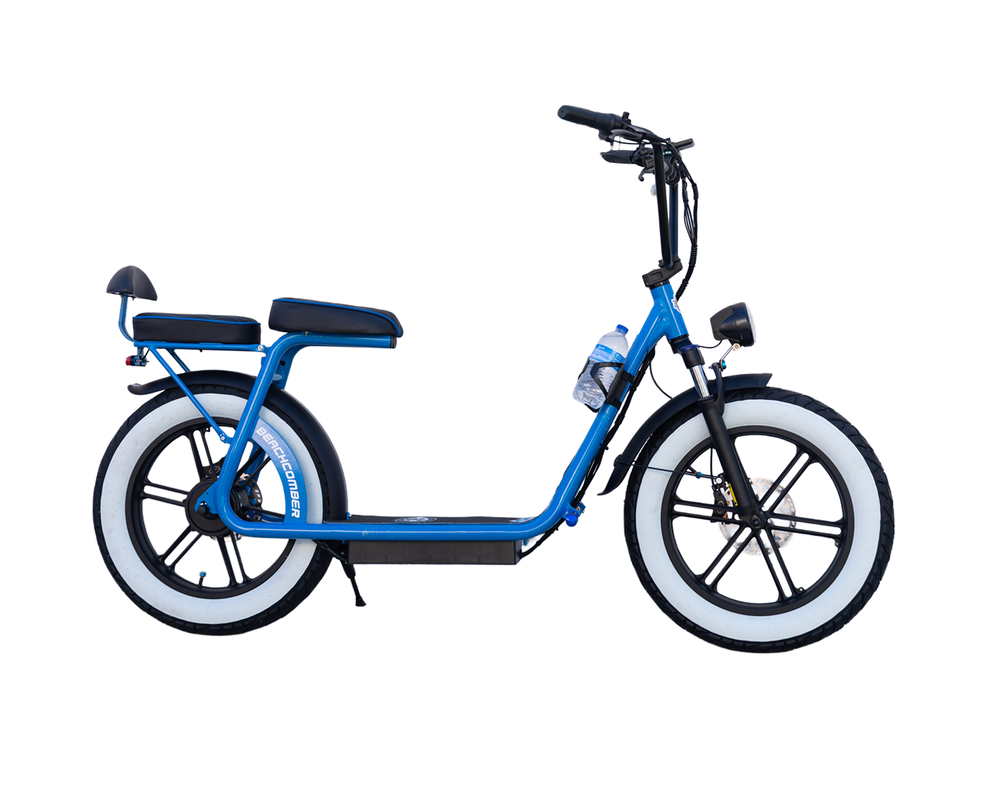 A red beachcomber electric bike is parked on a lush green field.