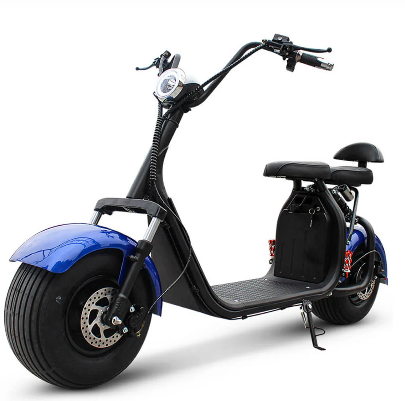 A black electric scooter is parked on the side of the road.