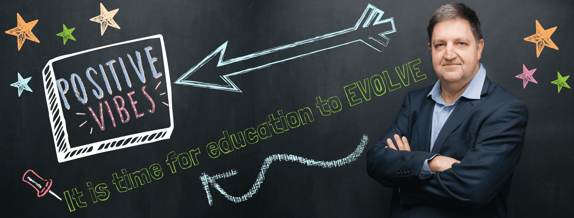 A man standing in front of a blackboard that says positive vibes
