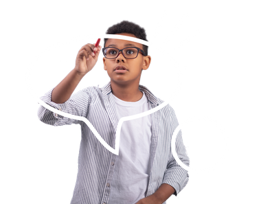 a young boy wearing glasses is drawing a line on a white board .