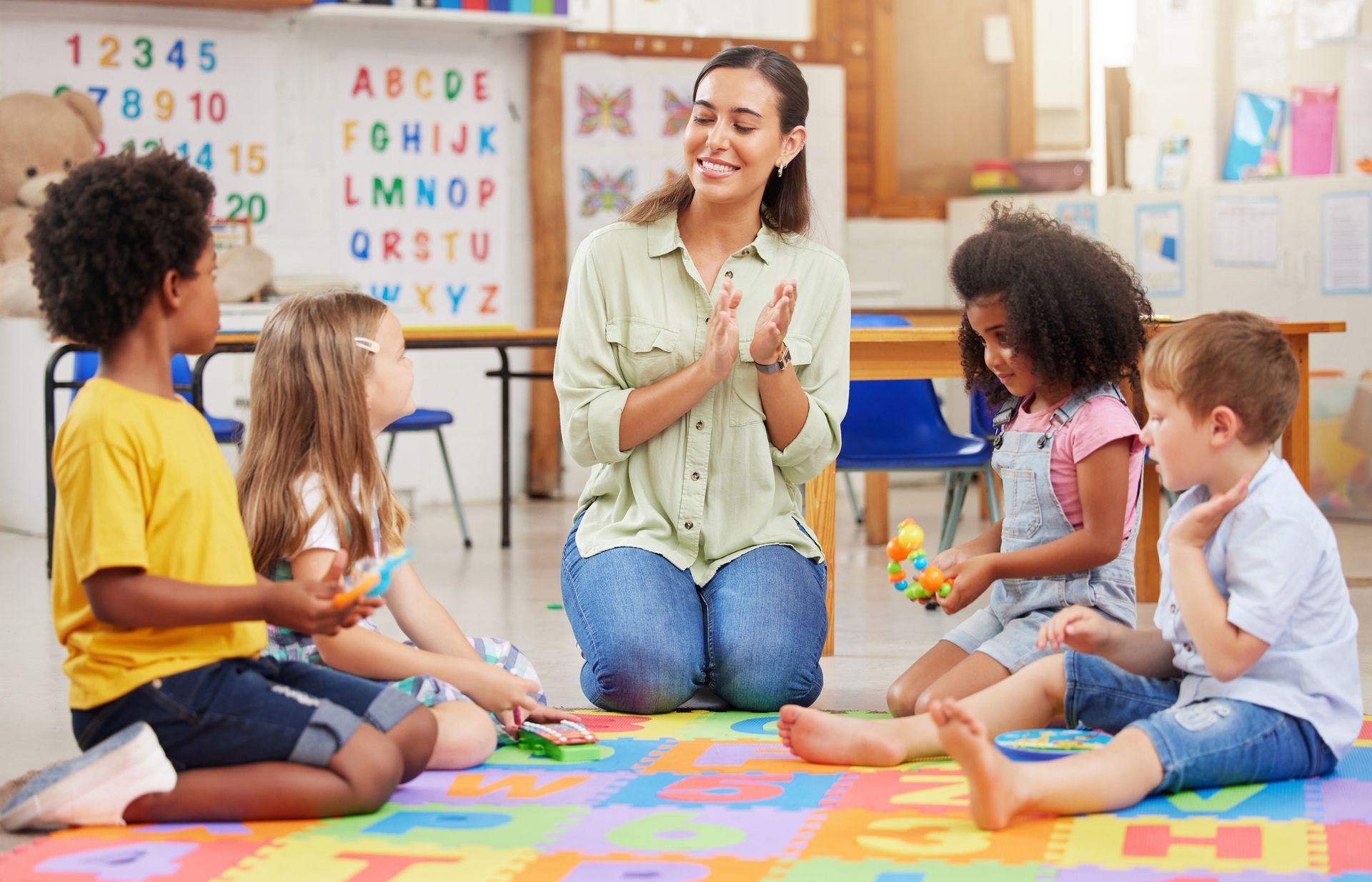 Children Sitting on The Floor with a Teacher — Springfield, VA — Spring N Dale Private School
