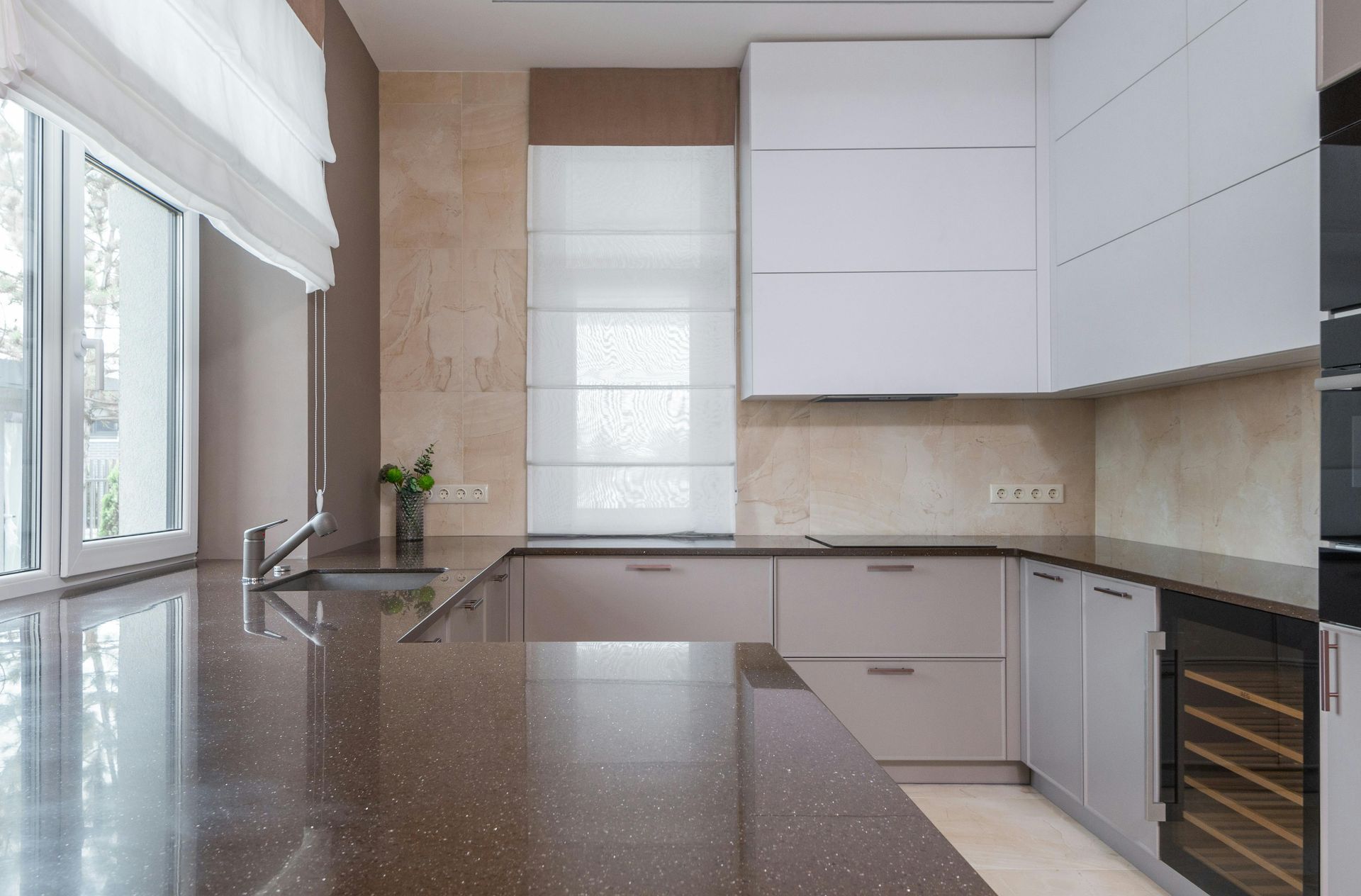 a kitchen under construction with a large island in the middle .