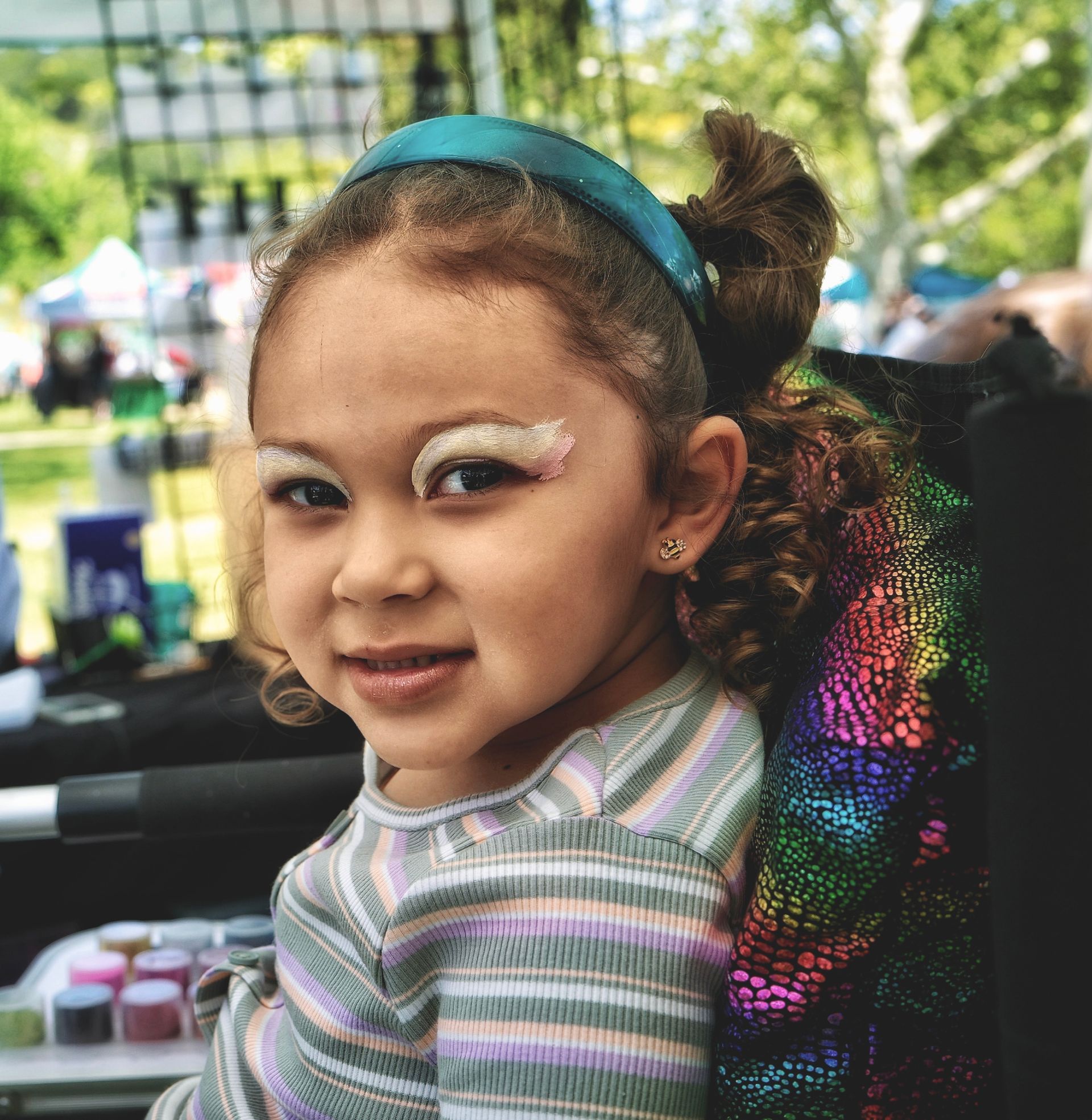 a girl with butterfly face painting 