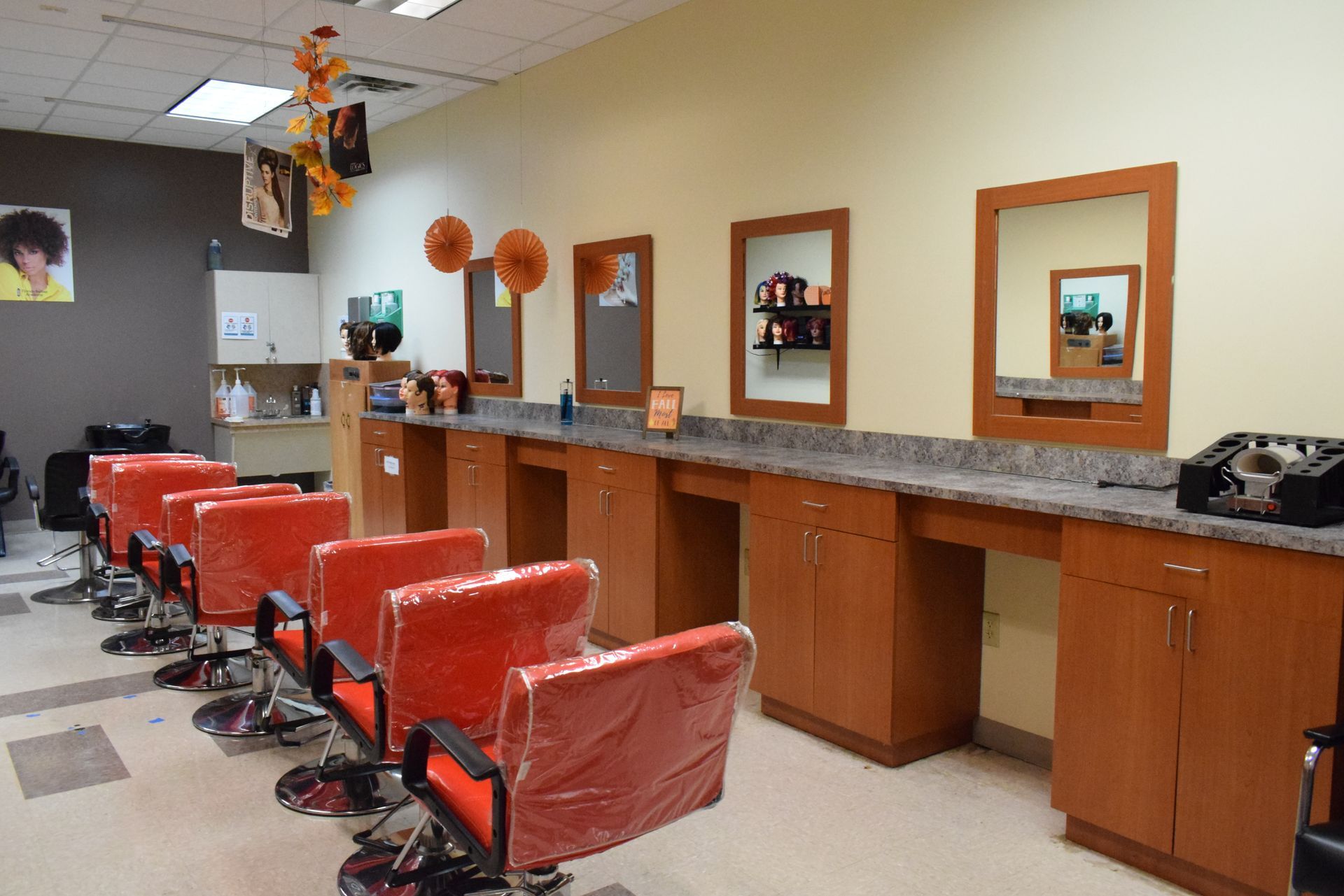 A hair salon with a lot of chairs and mirrors