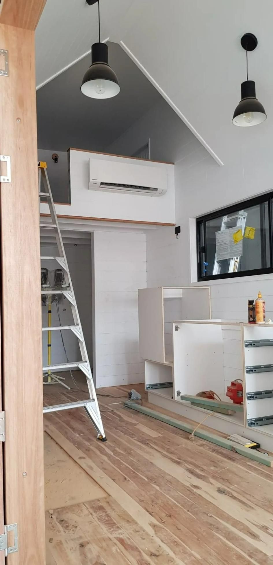 There Is a Ladder Beside AC in The Middle of The Room — Gleeson's Air Conditioning in Laurieton, NSW