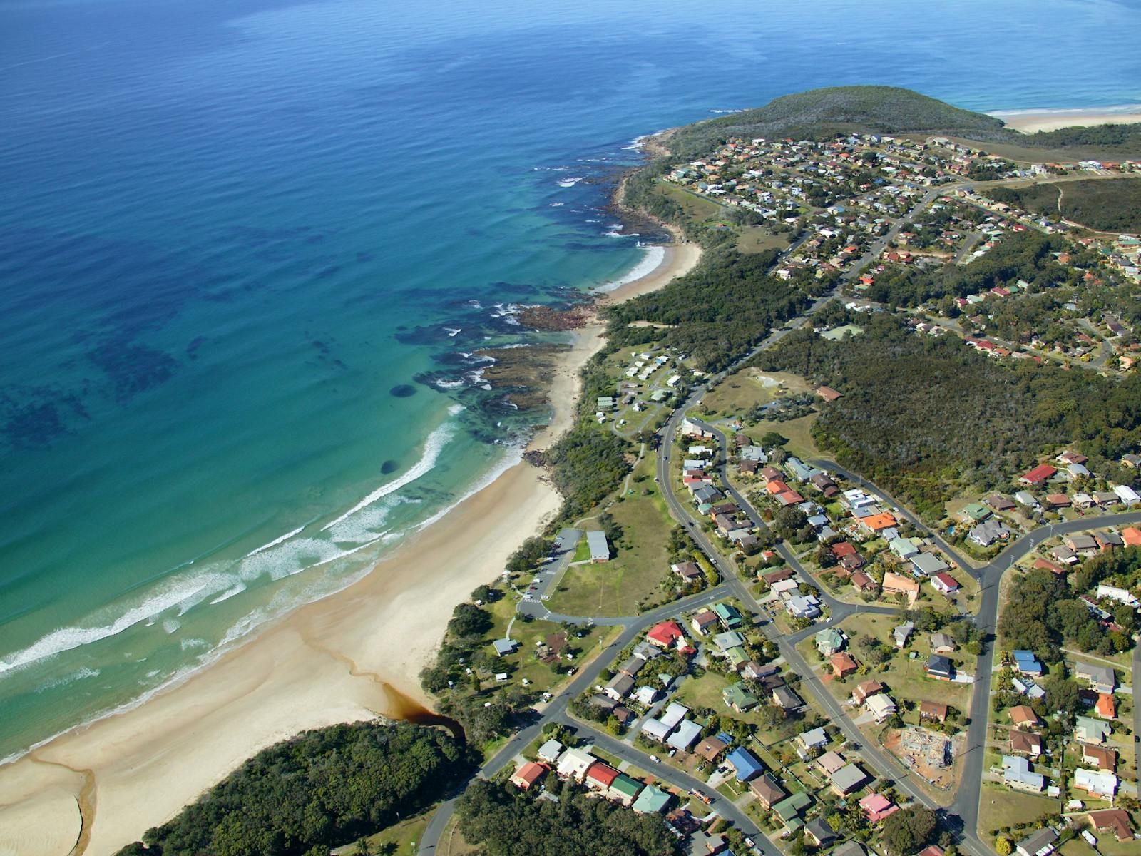 An aerial view of a town on the beach — Gleeson's Air Conditioning in Bonny Hills, NSW