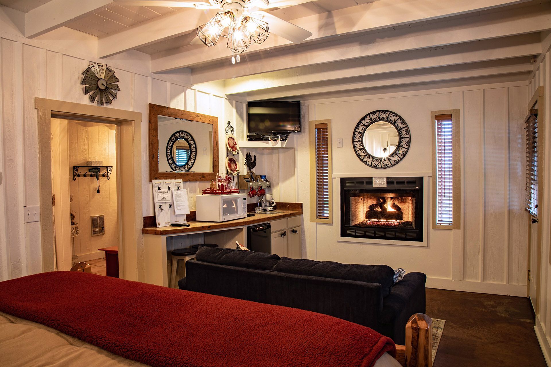 A living room with a fireplace and a couch