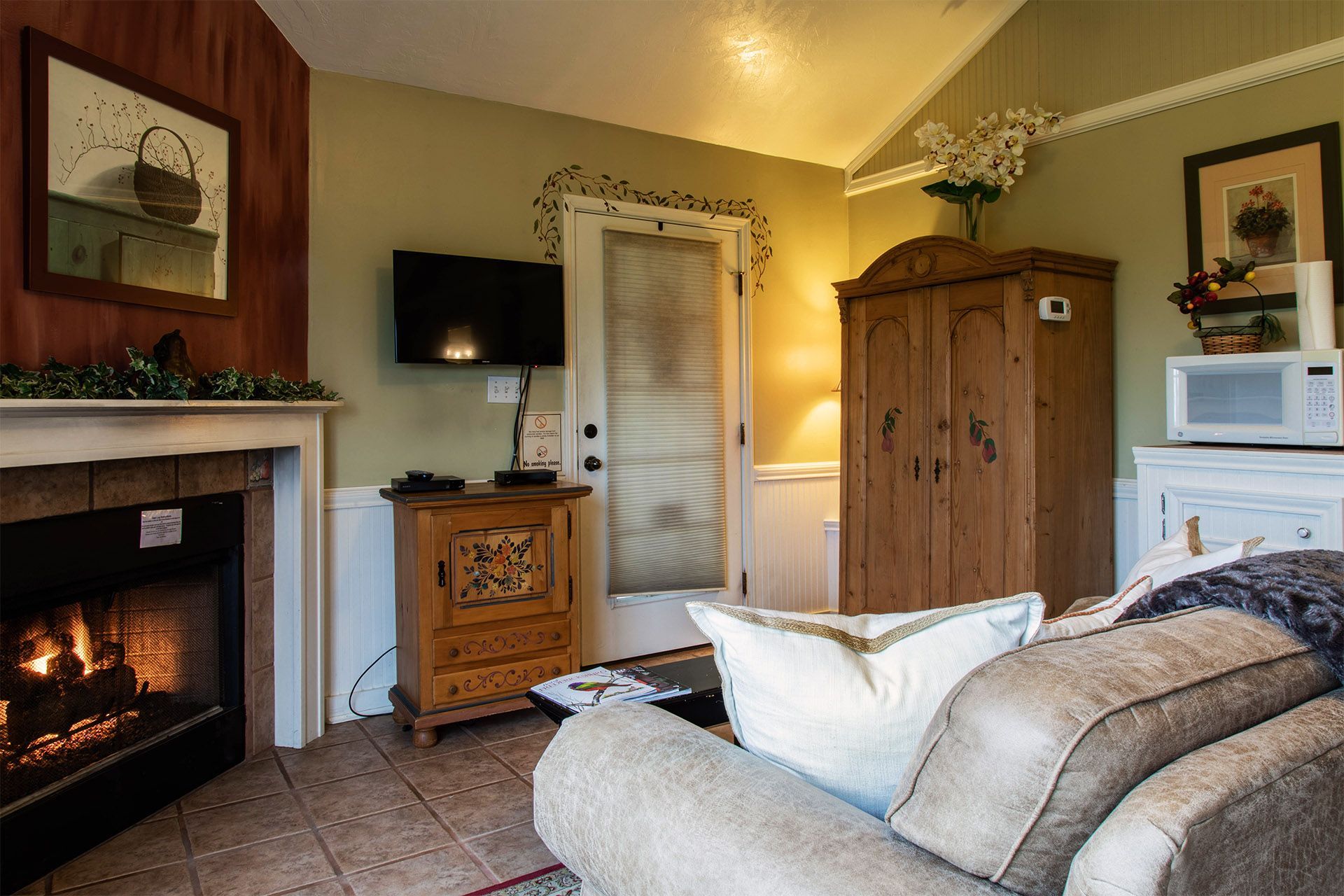 A living room with a fireplace and a couch