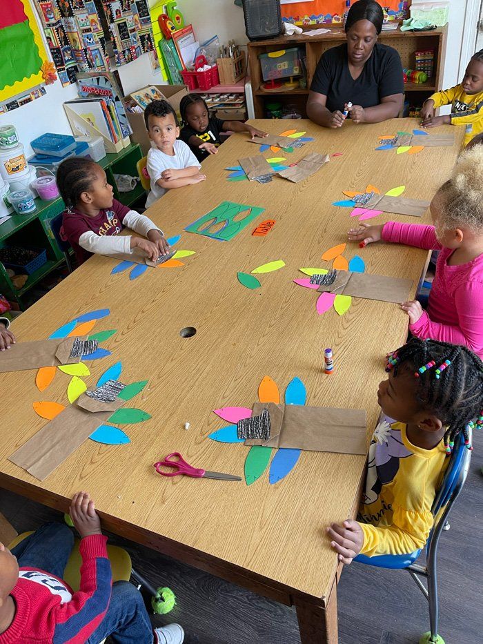 Children Doing Paper Artworks — Knoxville, TN — Marcia’s Learning Center