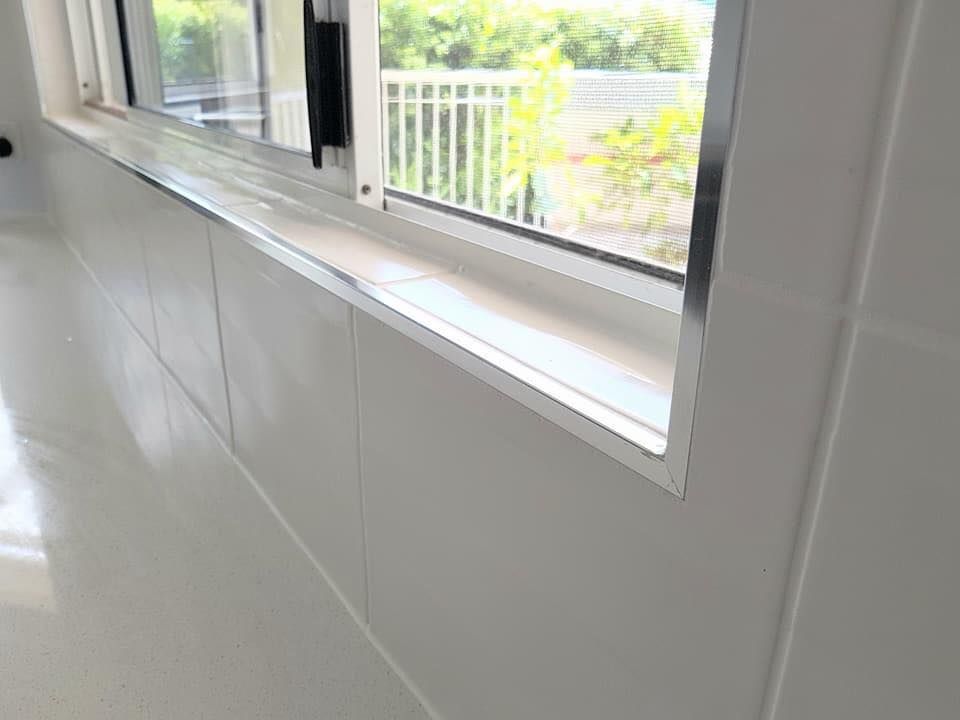 A Window in a White Room With a View of a Balcony — NGK Constructions In Freshwater, QLD