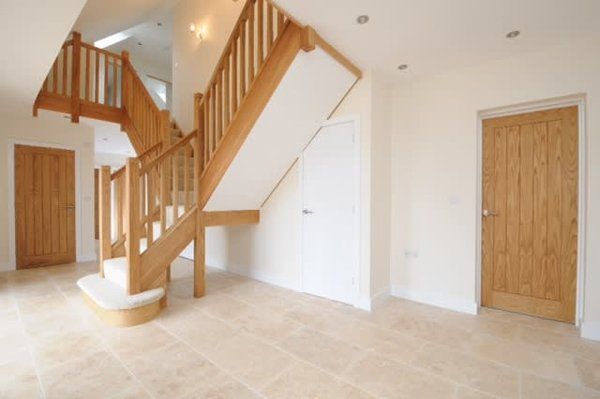 wooden staircase on white wall