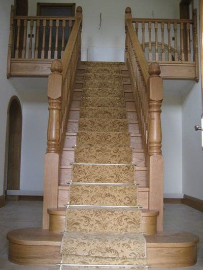 grand wooden staircase with bannisters