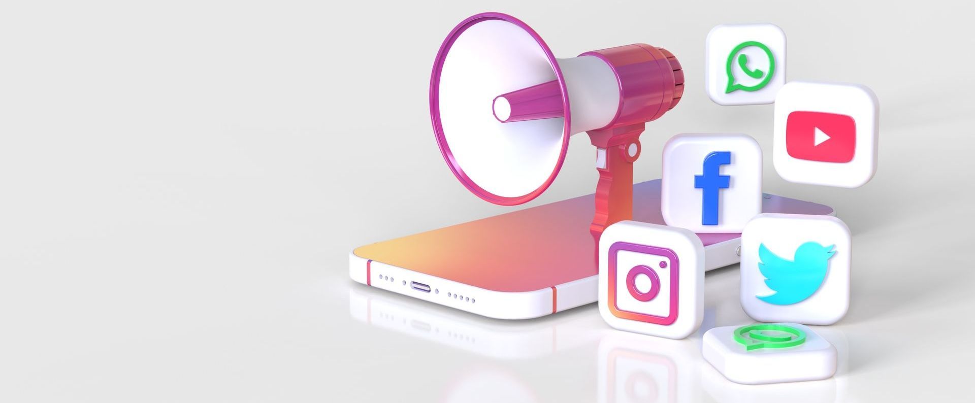 megaphone on top of mobile phone with social media icons coming out