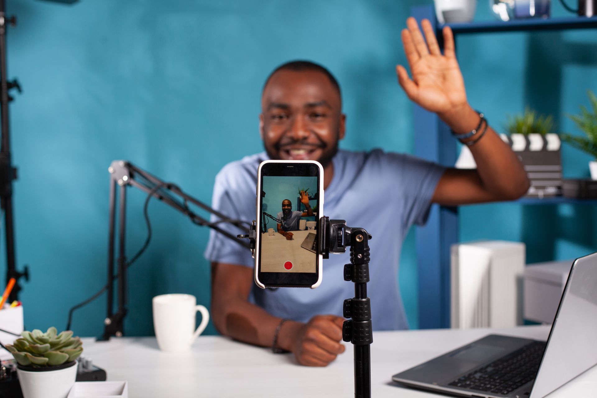 Person with notebook and computer making notes