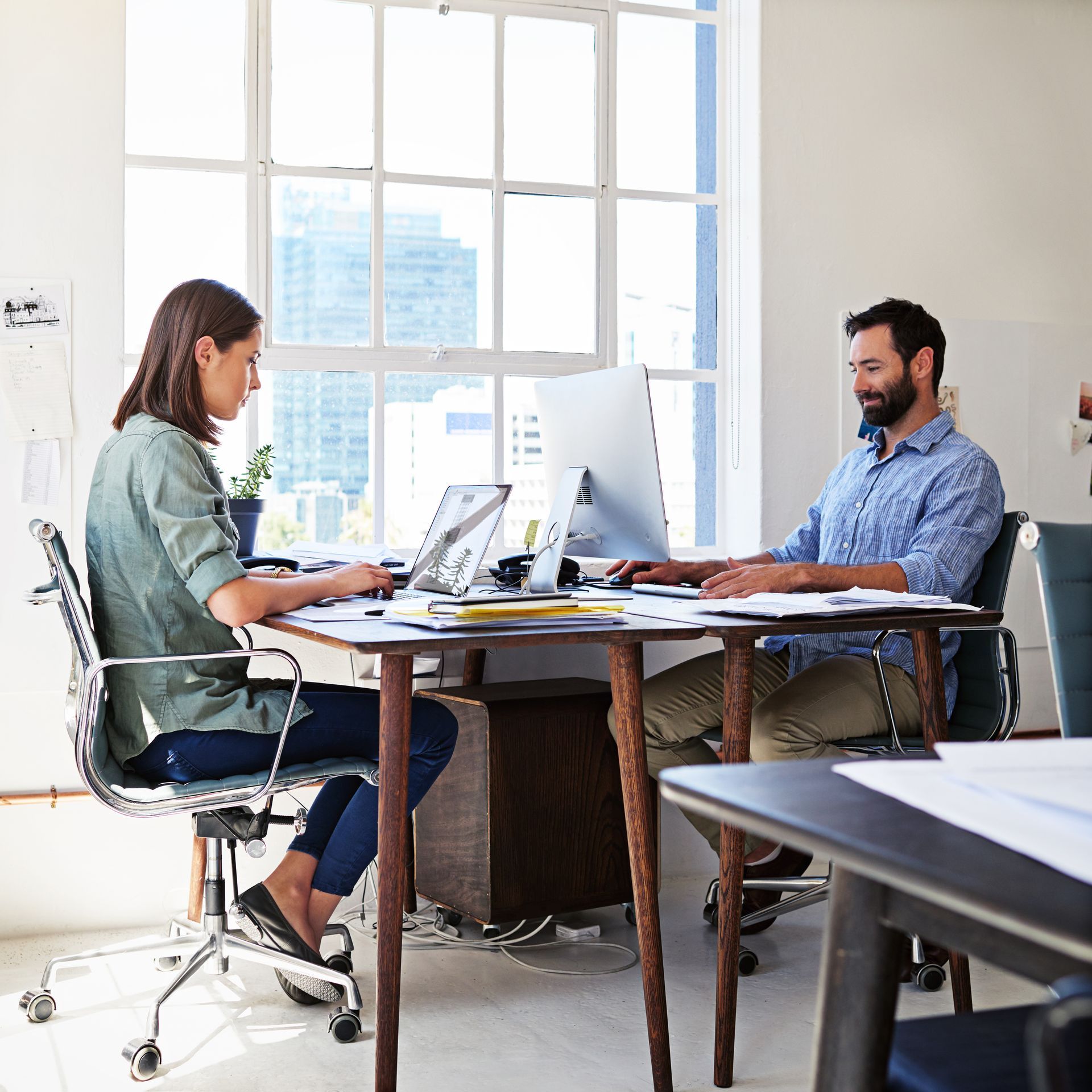 Man and woman working in office