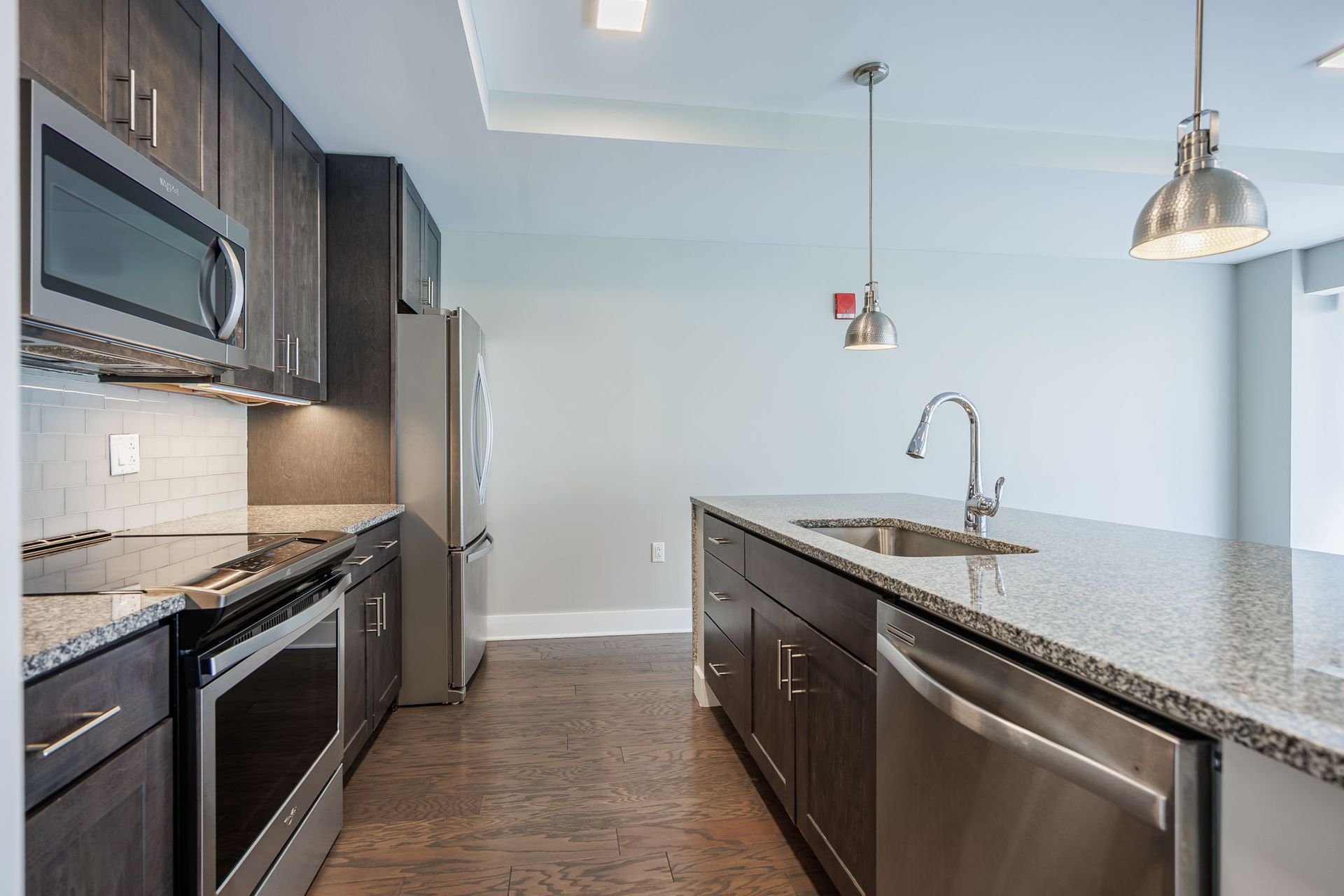 Modern kitchen with granite countertops and stainless steel appliances
