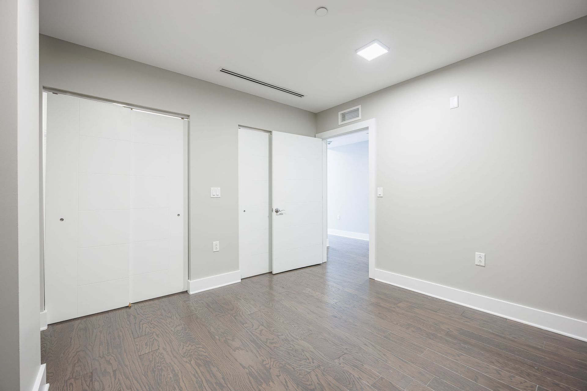 Modern bedroom with two closets