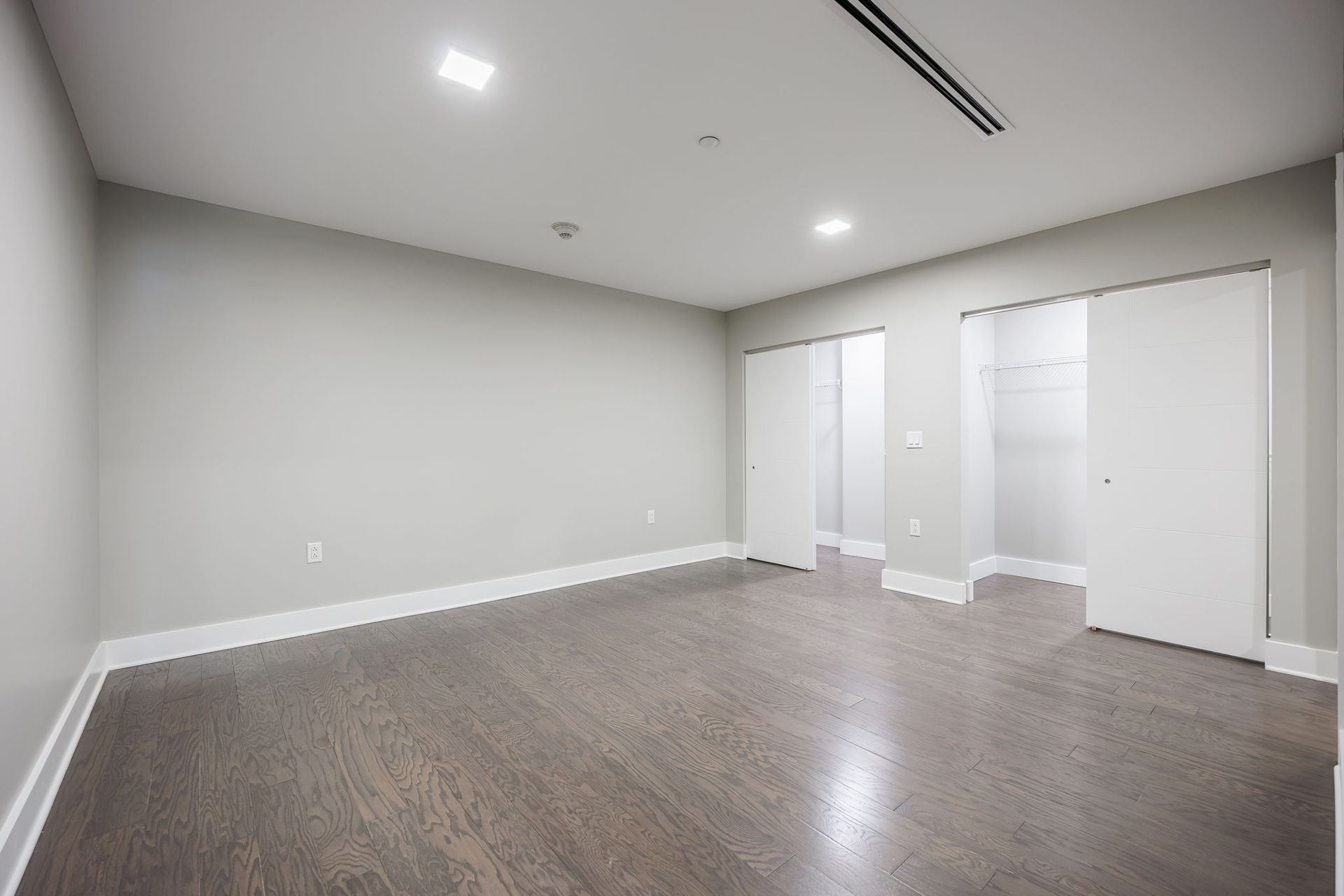 Modern bedroom with two large closets