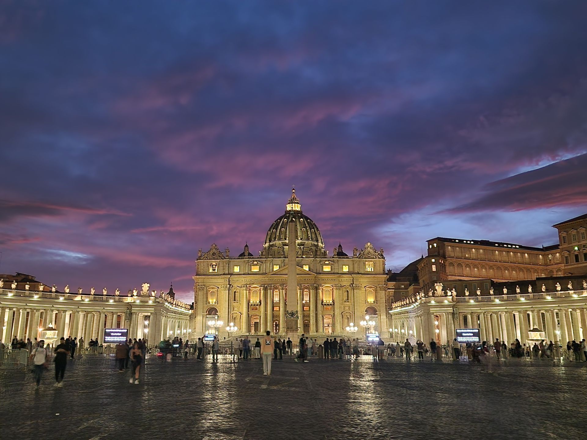Marble sculptures on display in a museum hallway with decorative walls and arched ceilings.