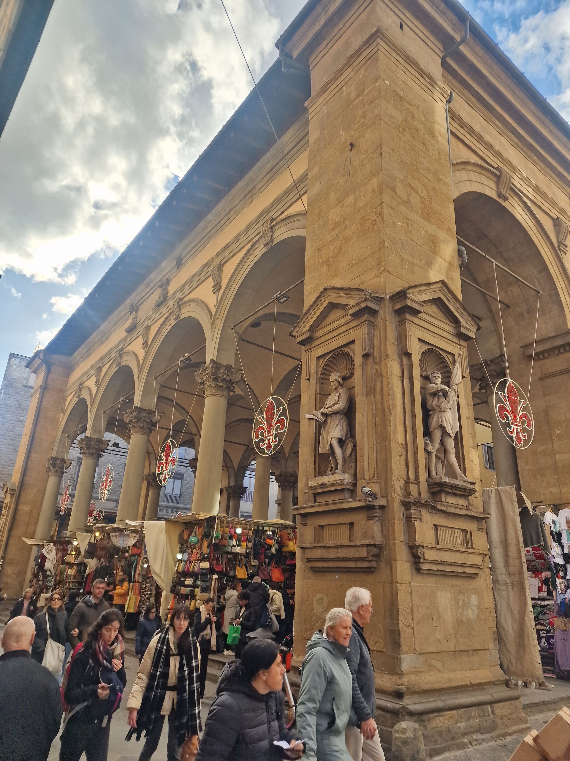 Leather market with people shopping in Florence.
