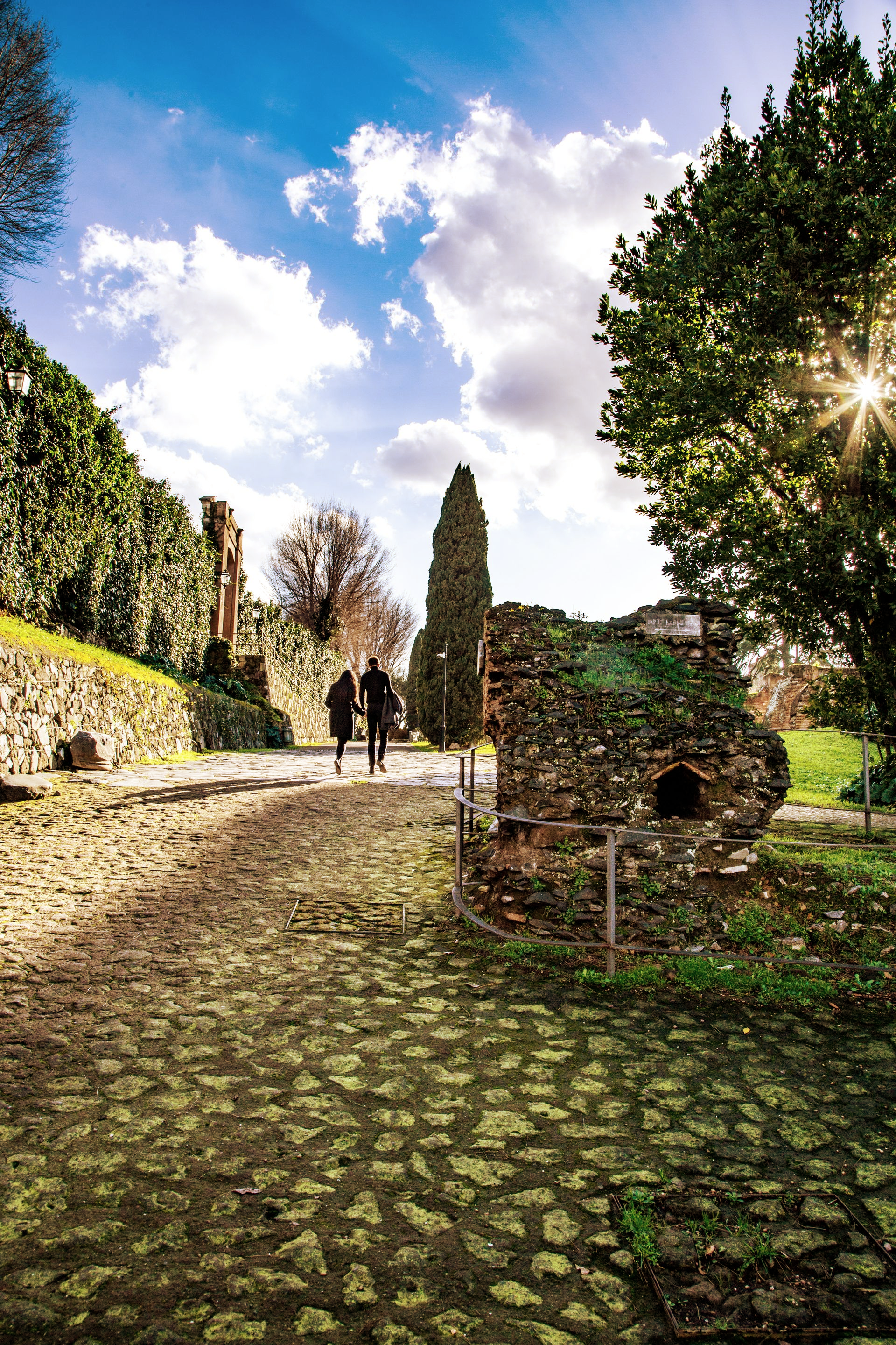 Couple walking on the Palatine Hill from the Arch of Titus
