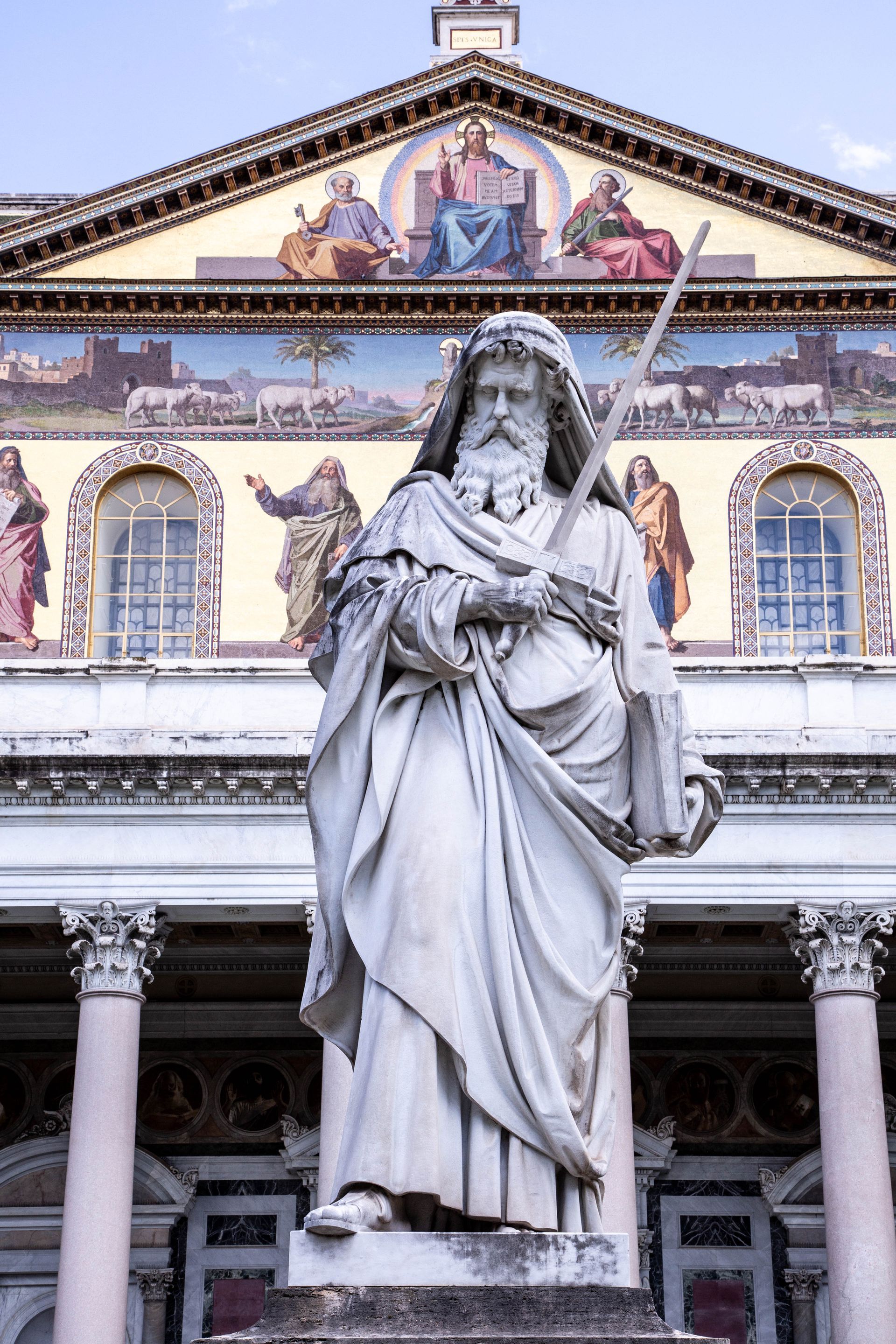 Cityscape of Rome, Italy, with historic buildings, domes, and warm sunlight.
