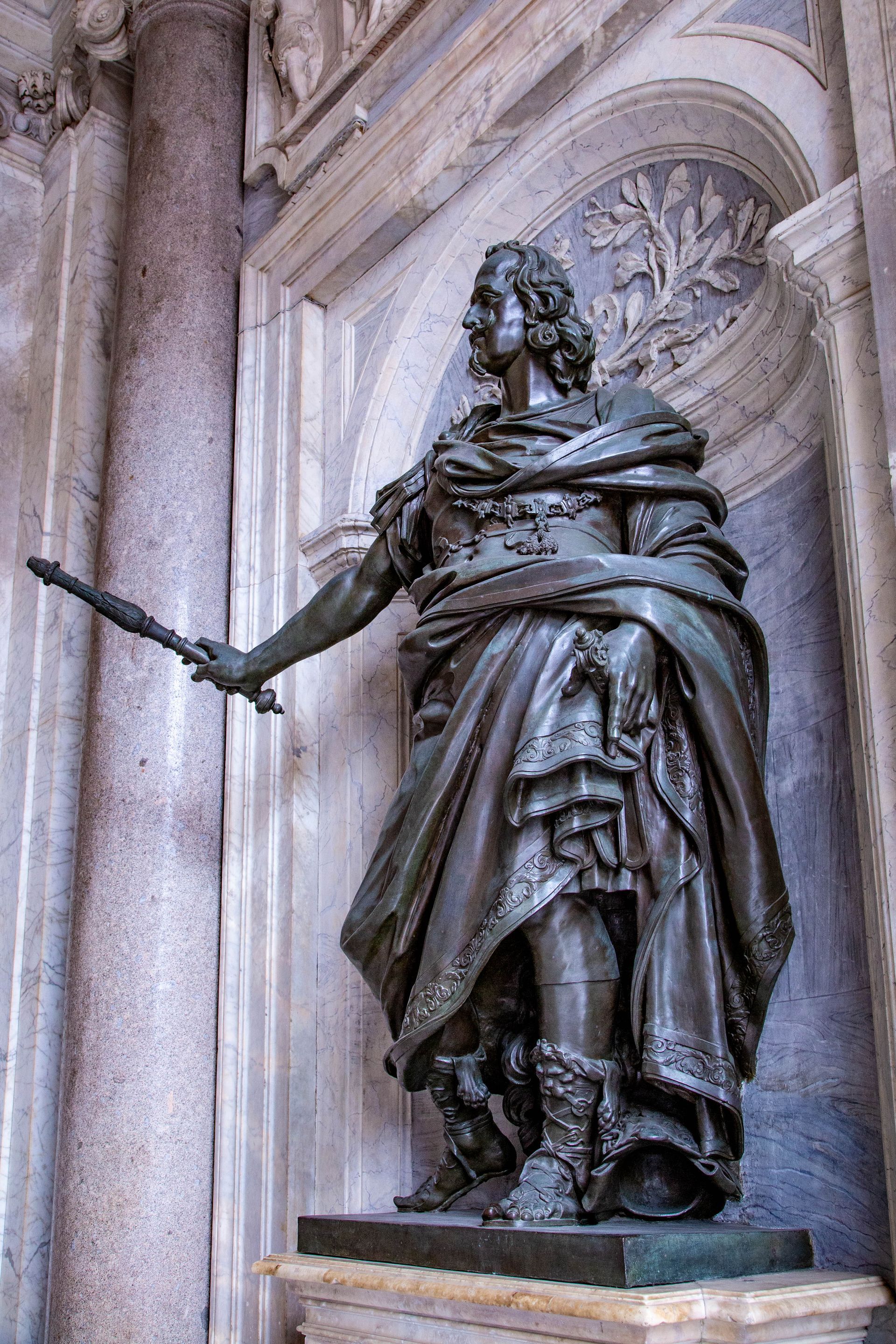 Cityscape of Rome, Italy, with historic buildings, domes, and warm sunlight.