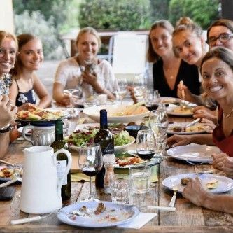 People drinking at a cooking class  in Tuscany.