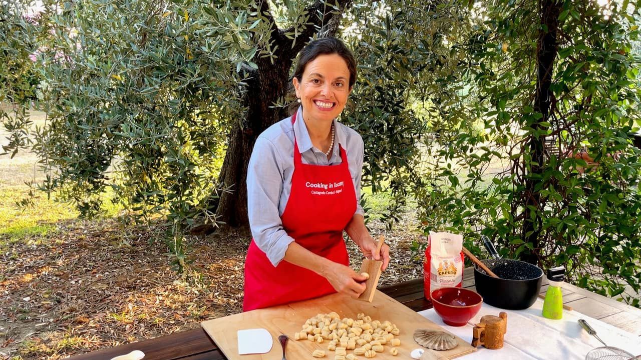 Chicca making gnocchi at cooking class in Tuscany.