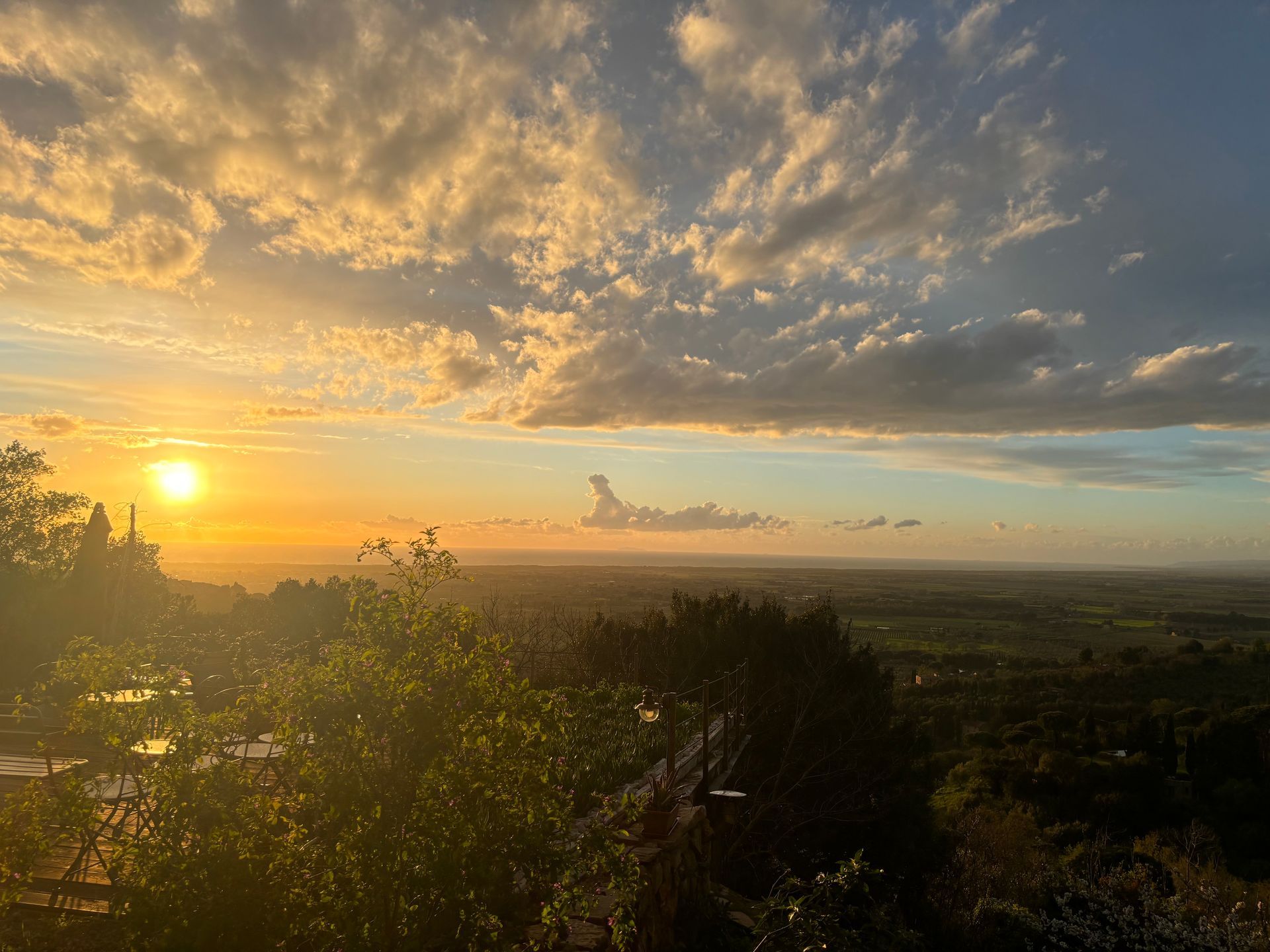 Sunset over the hills and coast in Tuscany.