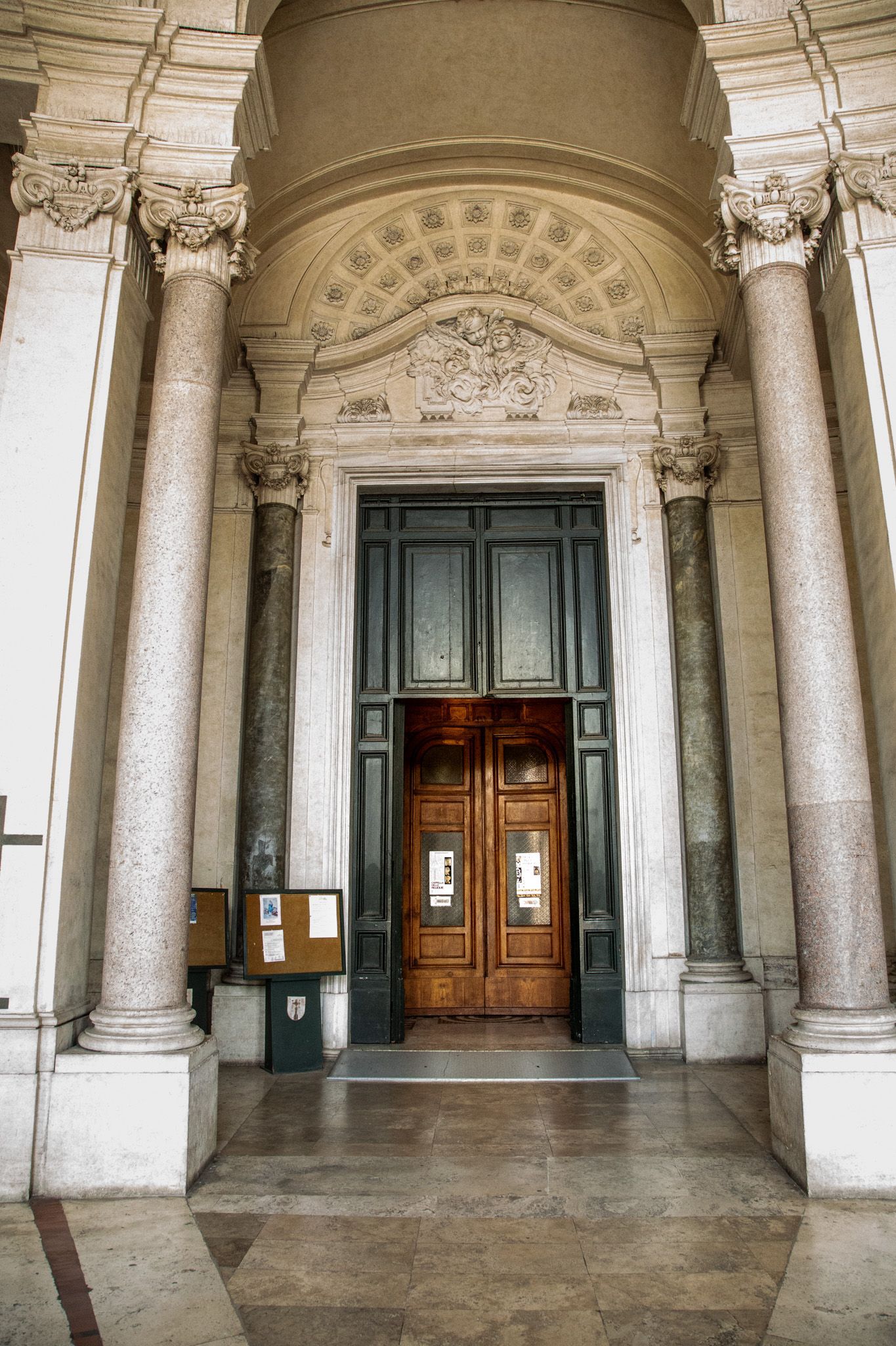 Arch of Constantine and Colosseum in Rome, Italy, at dusk.