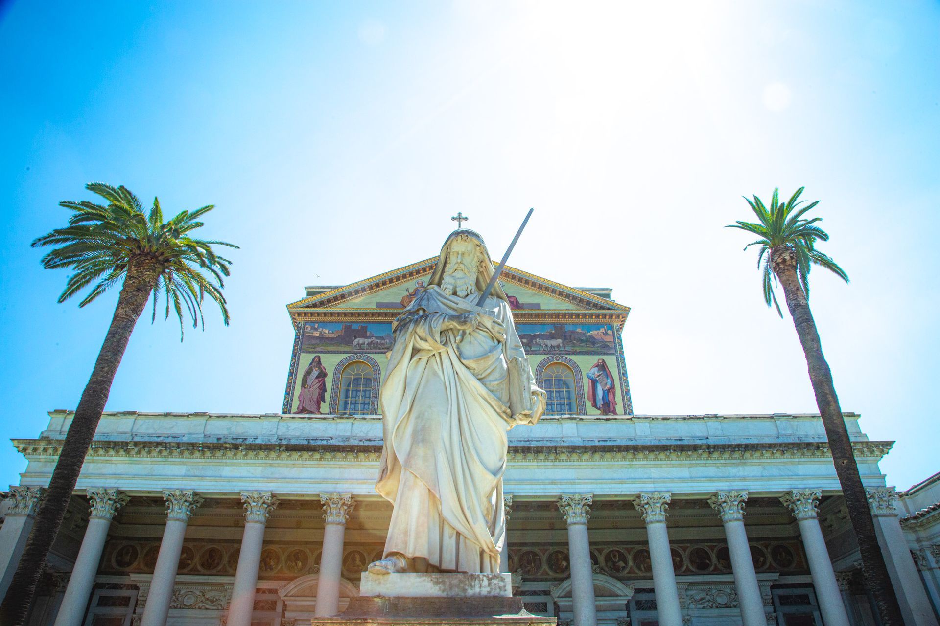 Arch of Constantine and Colosseum in Rome, Italy, at dusk.
