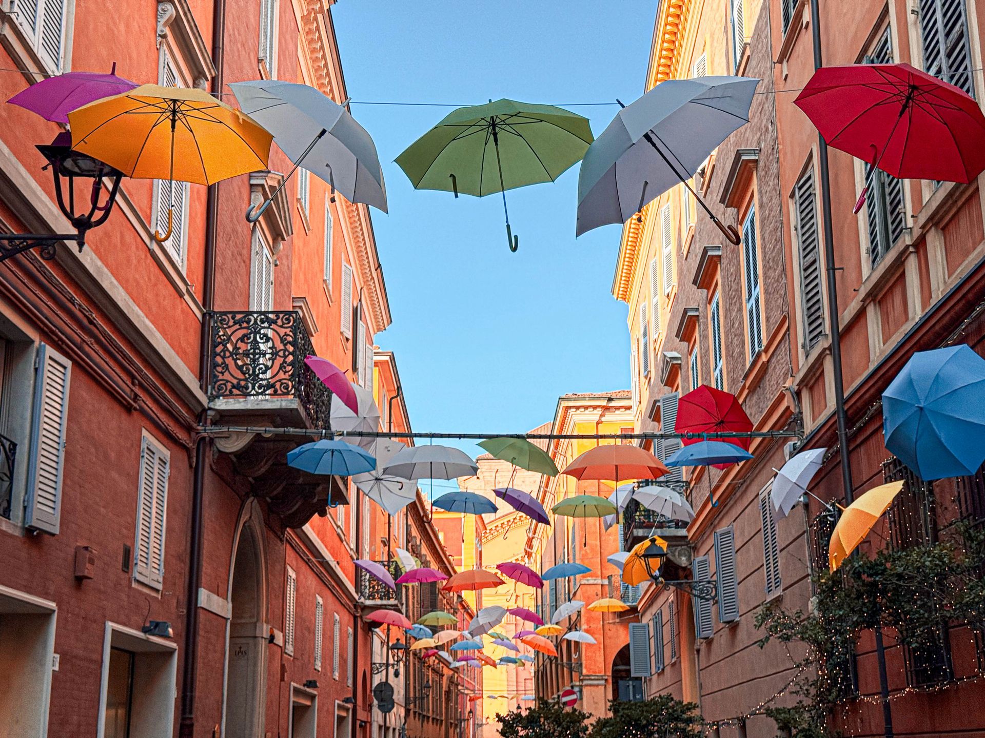 Venice street decorated with colorful umbrellas.