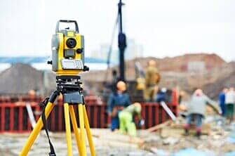 Surveyor Equipment At Construction Site — Land Development & Planning Engineers in Hopkinton, MA