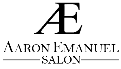 The logo for aaron emanuel salon is black and white.