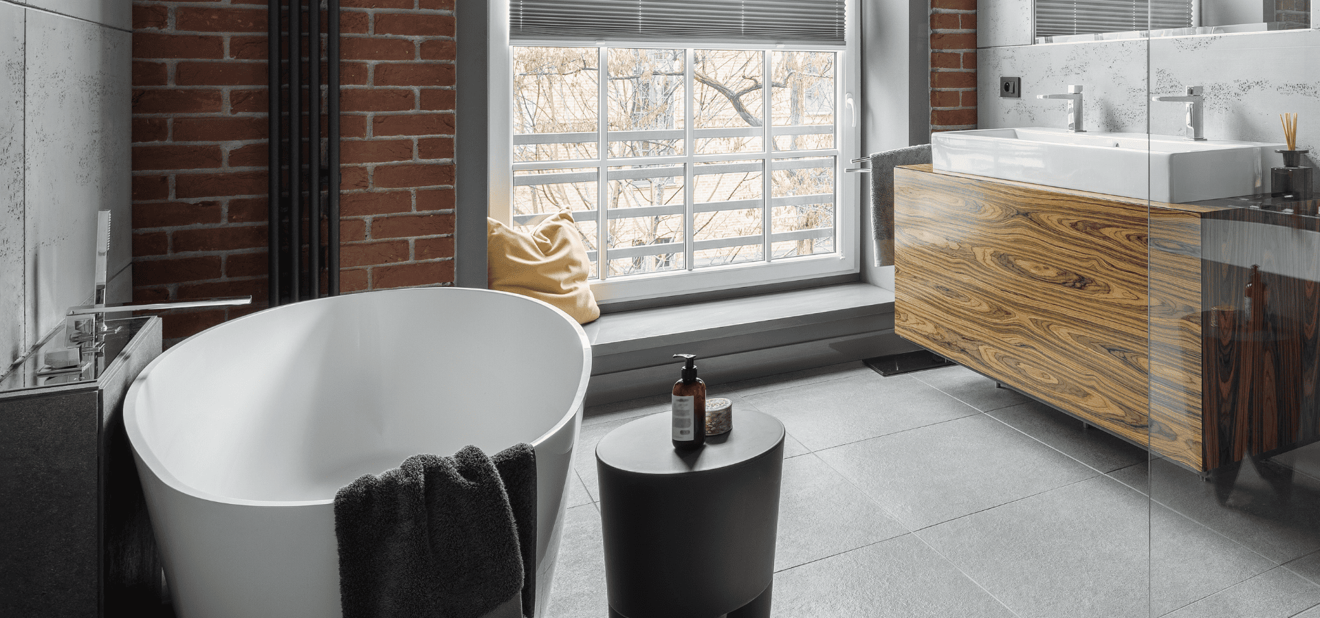 Industrial bathroom with a wooden cabinet sink