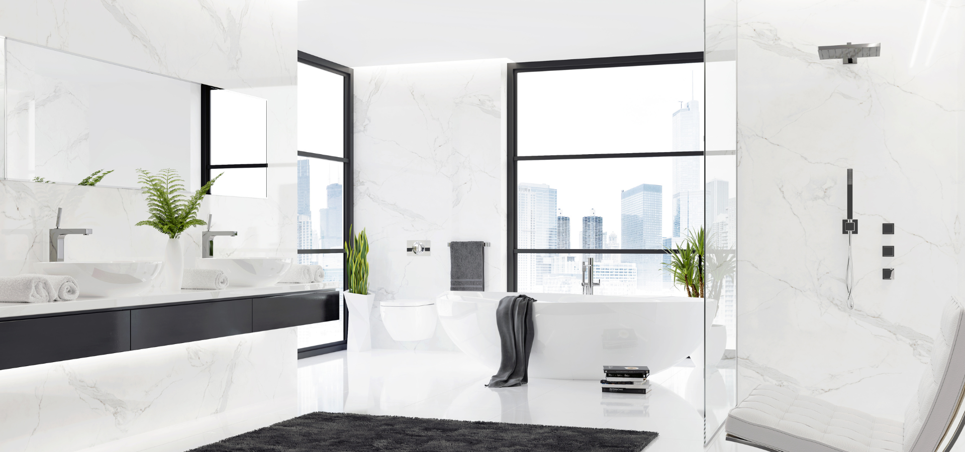 Minimalist luxury bathroom featuring marble walls and flooring, along with white fixtures