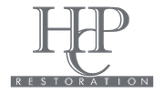 Gray &ldquo;HHP&rdquo; logo with &ldquo;RESTORATION&rdquo; in spaced white letters on a dark banner below.
